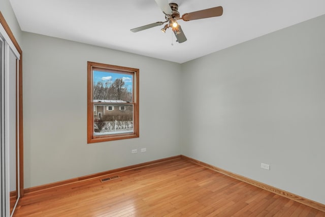 unfurnished room featuring ceiling fan and light hardwood / wood-style floors