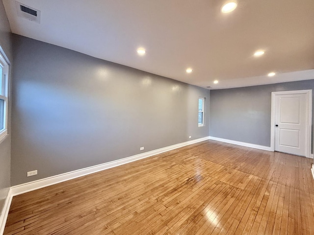 unfurnished room with light hardwood / wood-style flooring