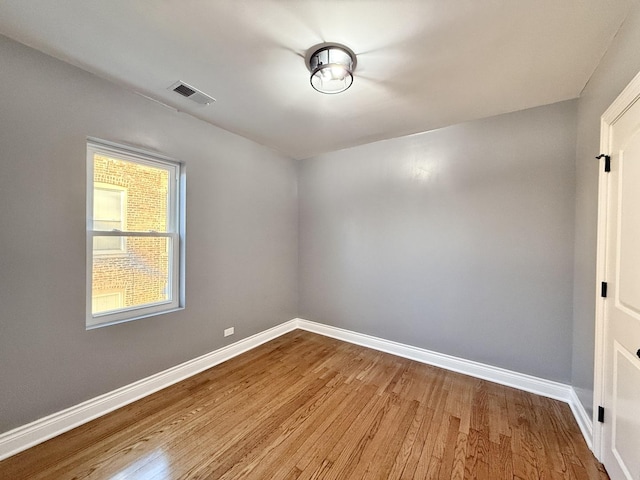 spare room with light hardwood / wood-style floors