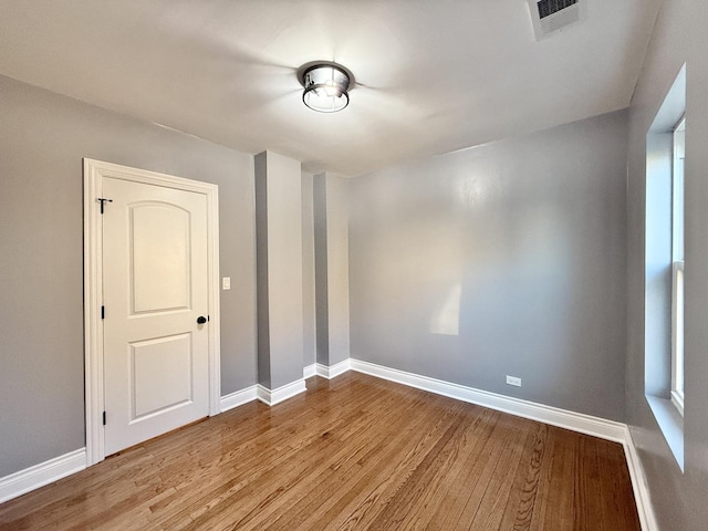 spare room featuring light hardwood / wood-style flooring