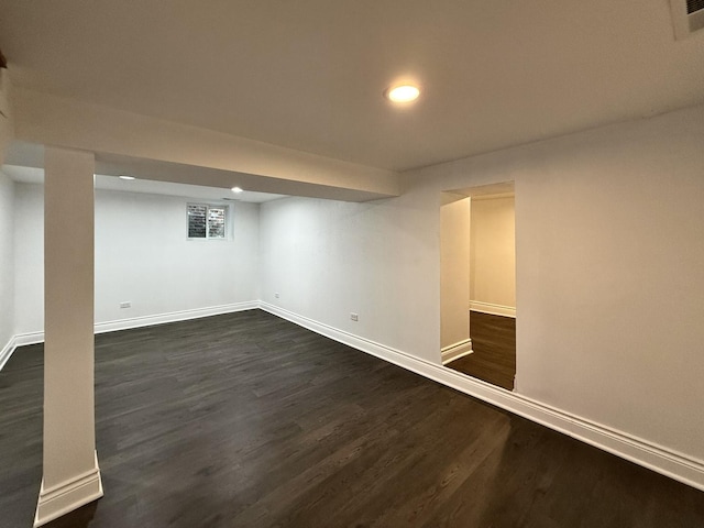 basement with dark wood-type flooring