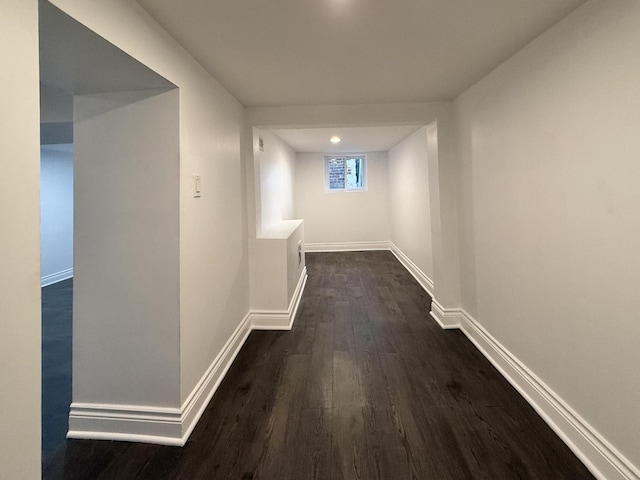 hallway featuring dark wood-type flooring