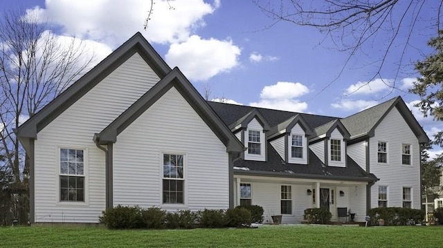 view of front of home featuring a front yard and covered porch