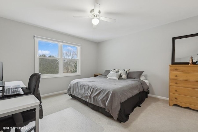 bedroom featuring ceiling fan and light carpet