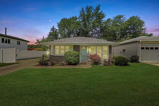 view of front of home featuring a lawn