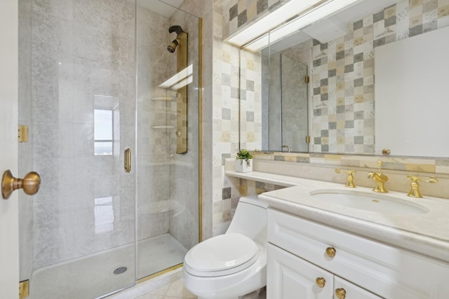 bathroom with a shower with shower door, toilet, vanity, and tile patterned flooring