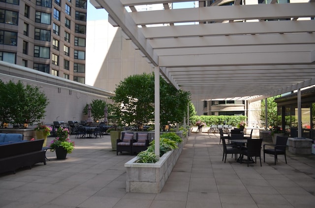 view of patio with an outdoor hangout area and a pergola