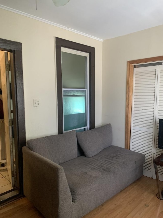 living room featuring ornamental molding and hardwood / wood-style floors