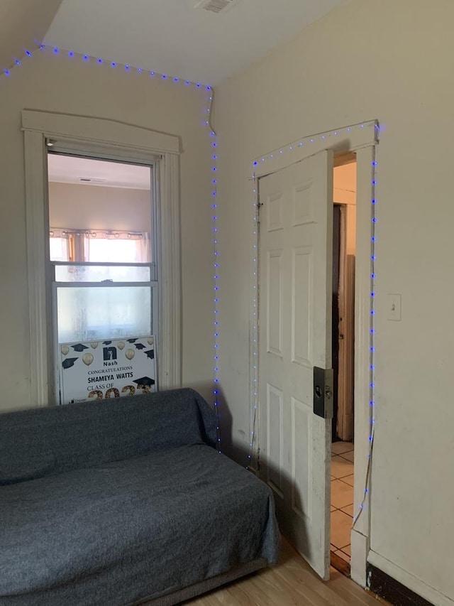 bedroom with wood-type flooring