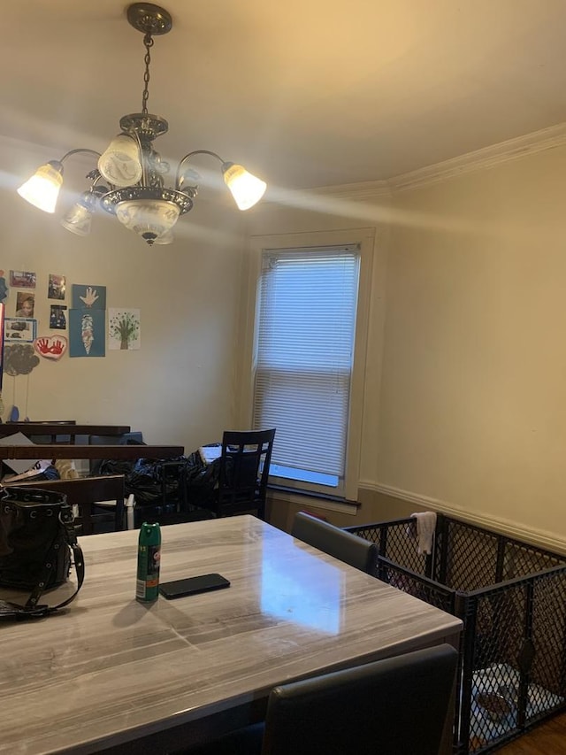 dining room featuring an inviting chandelier and ornamental molding