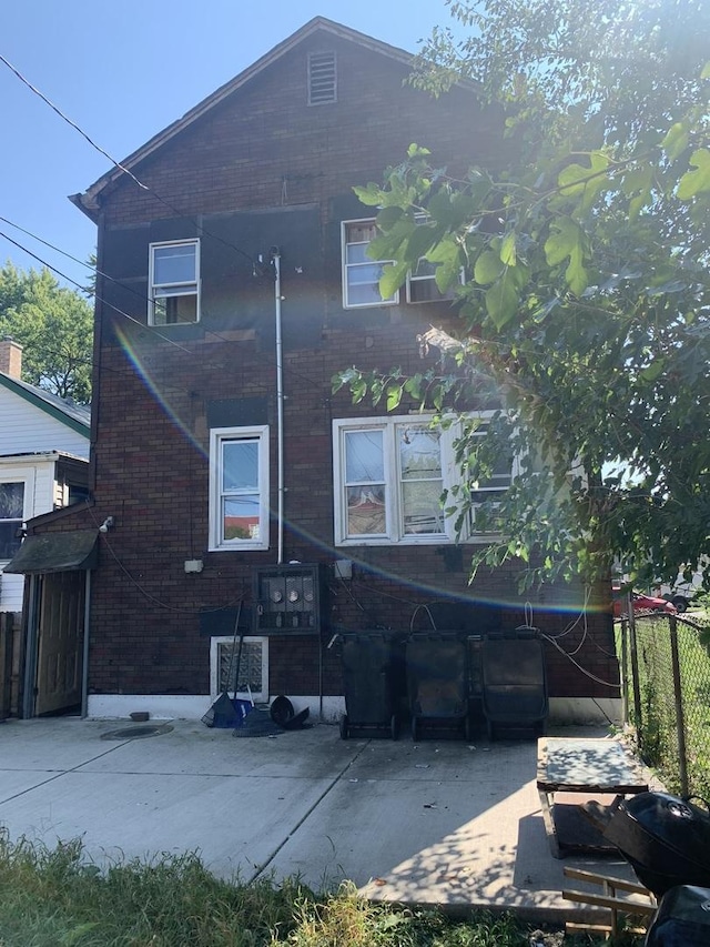 rear view of property featuring a patio area