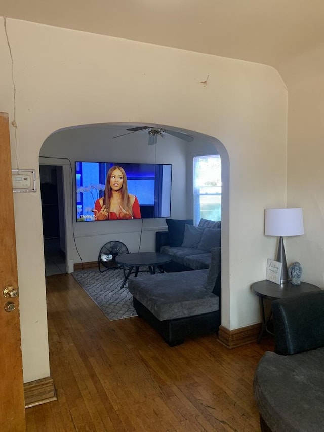 living room with ceiling fan and hardwood / wood-style flooring