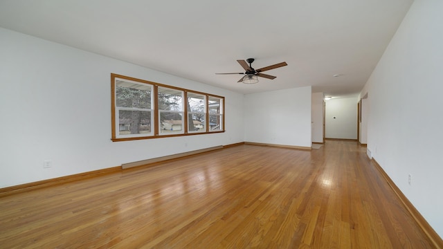 spare room featuring ceiling fan and light wood-type flooring