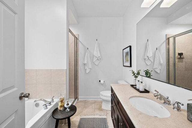 full bathroom with a skylight, tile patterned flooring, vanity, separate shower and tub, and toilet