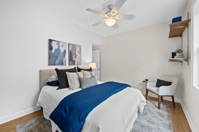 bedroom featuring light hardwood / wood-style flooring and ceiling fan