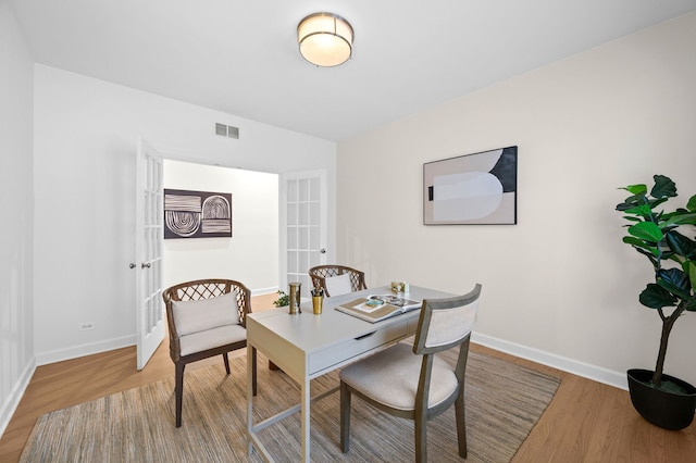 dining area with wood-type flooring