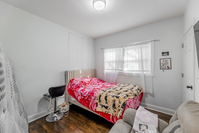 bedroom featuring dark wood-type flooring