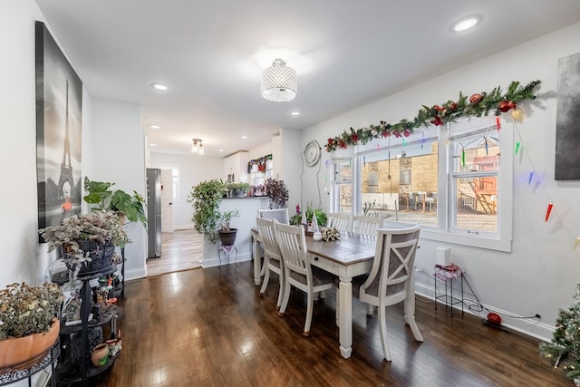 dining area with dark hardwood / wood-style floors