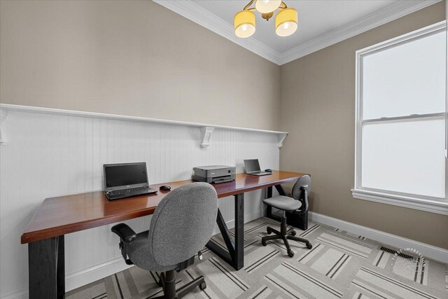 carpeted home office featuring ornamental molding and a chandelier