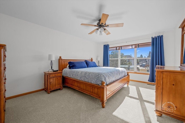 bedroom with light carpet and ceiling fan