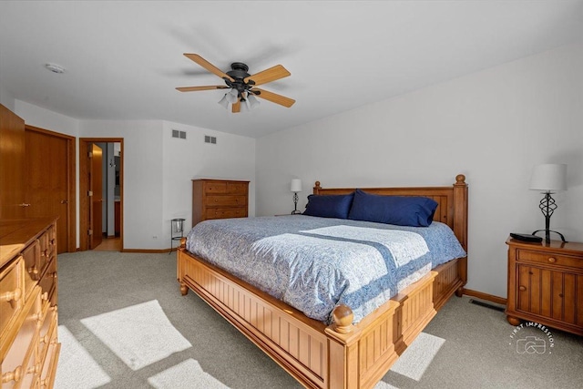 bedroom with light colored carpet and ceiling fan