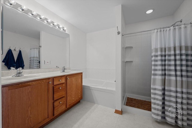 bathroom featuring shower with separate bathtub and vanity