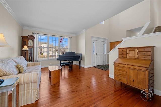 living room with dark hardwood / wood-style flooring and ornamental molding