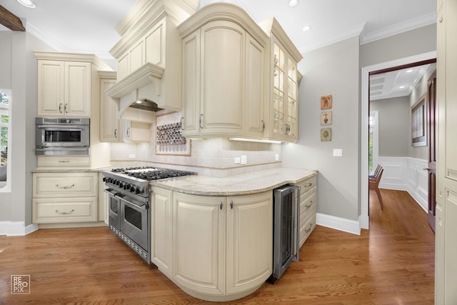 840 Chestnut St, Hinsdale, IL 60521 - kitchen with appliances with stainless steel finishes, cream cabinets, beverage cooler, backsplash, and glass insert cabinets