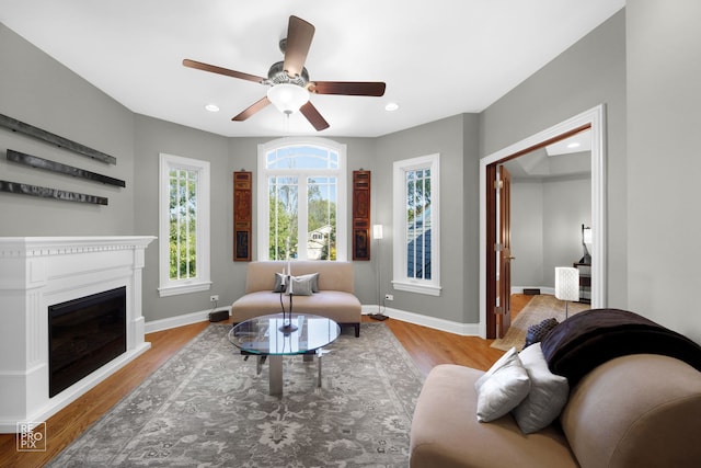 840 Chestnut St, Hinsdale, IL 60521 - living room with wood finished floors, a ceiling fan, baseboards, a glass covered fireplace, and recessed lighting
