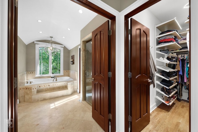 840 Chestnut St, Hinsdale, IL 60521 - full bathroom with a spacious closet, a garden tub, vaulted ceiling, a shower stall, and recessed lighting