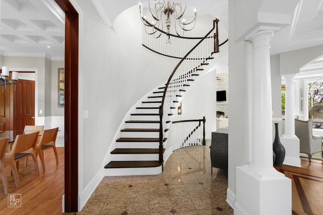 840 Chestnut St, Hinsdale, IL 60521 - stairs with crown molding, coffered ceiling, decorative columns, baseboards, and a stone fireplace