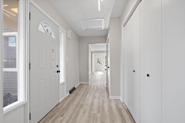 entryway with plenty of natural light and light hardwood / wood-style floors