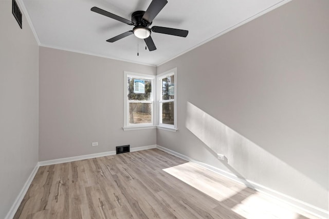 spare room with ceiling fan, ornamental molding, and light hardwood / wood-style floors