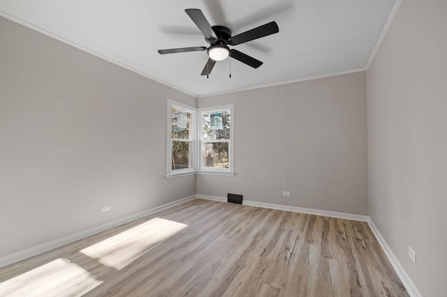 unfurnished room featuring ceiling fan, ornamental molding, and light wood-type flooring