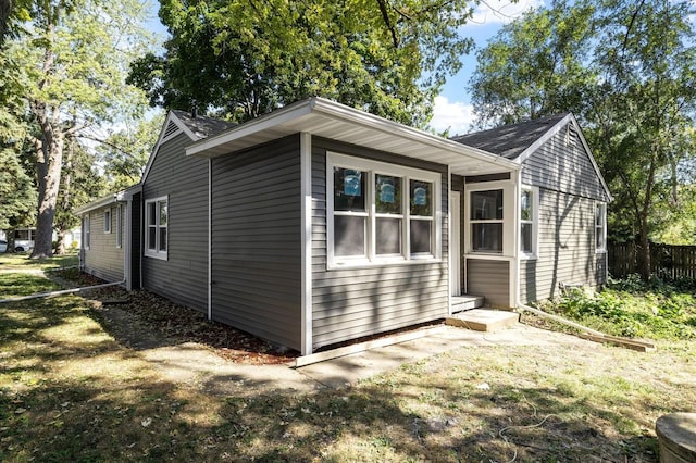 view of side of home featuring a yard