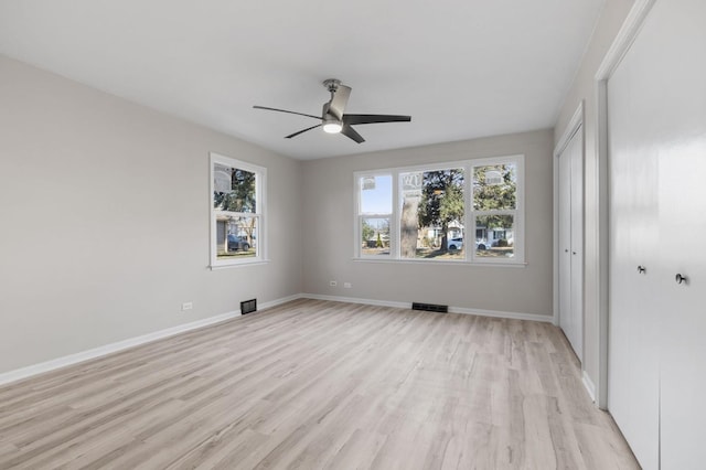 unfurnished bedroom featuring ceiling fan and light hardwood / wood-style flooring