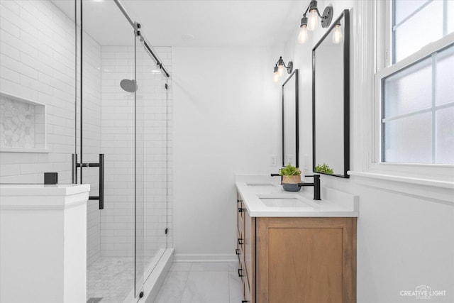 bathroom with walk in shower and vanity