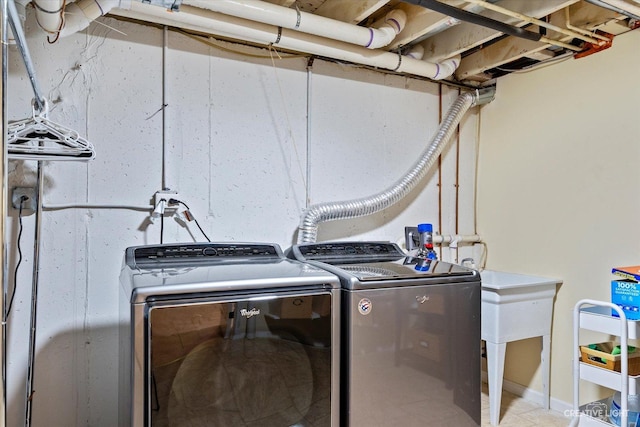 washroom featuring washer and dryer