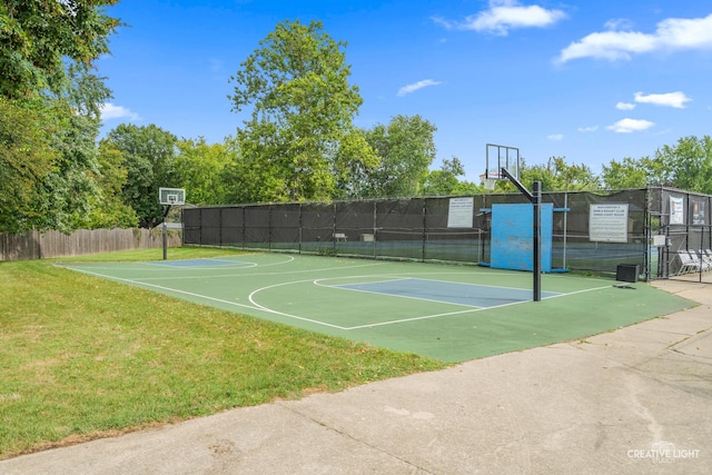 view of basketball court featuring a yard and tennis court