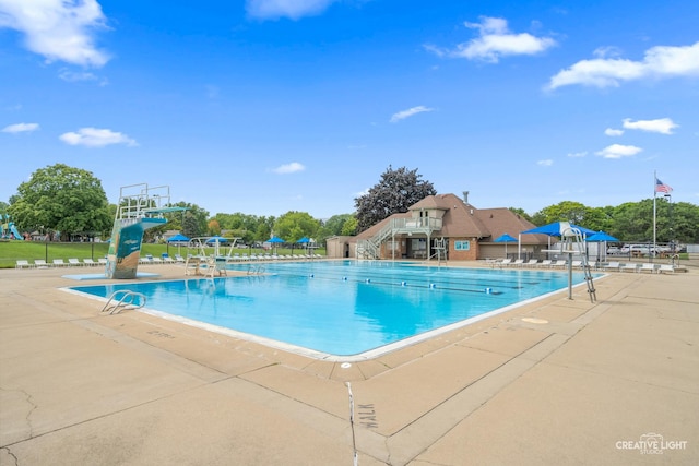 view of swimming pool with a patio area