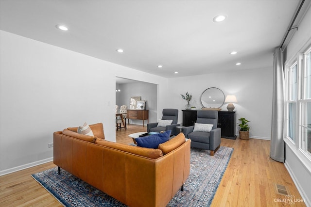 living room with light hardwood / wood-style floors