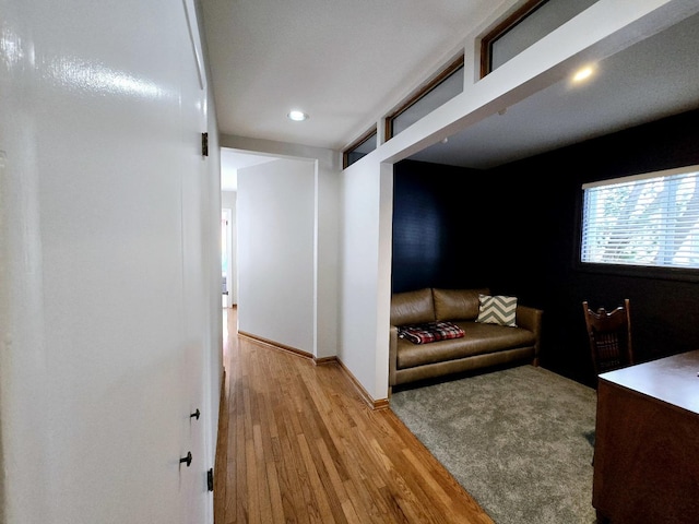 interior space featuring recessed lighting, baseboards, and light wood-style floors