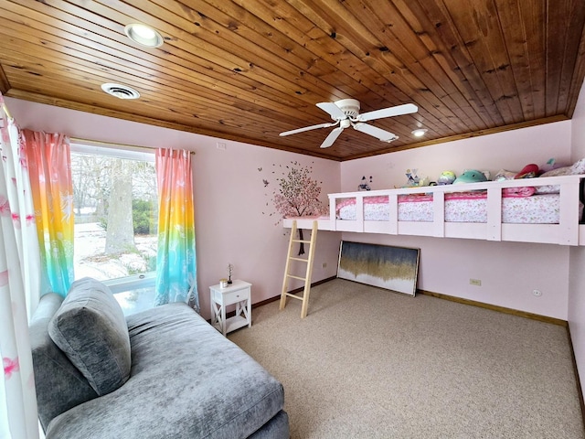 carpeted bedroom with visible vents, baseboards, wooden ceiling, and crown molding