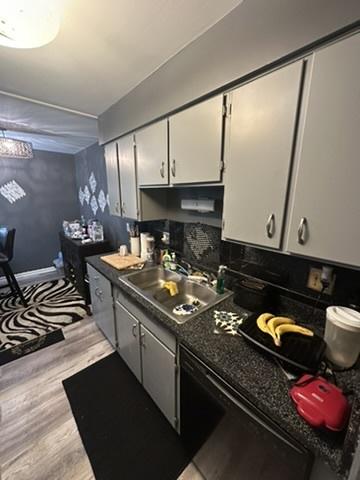 931 W Arquilla Dr Unit 316, Glenwood, IL 60425 - kitchen featuring a sink, light wood-type flooring, dark countertops, and white cabinetry