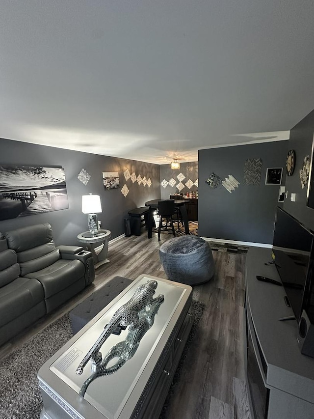 931 W Arquilla Dr Unit 316, Glenwood, IL 60425 - living area featuring dark wood-type flooring and an accent wall