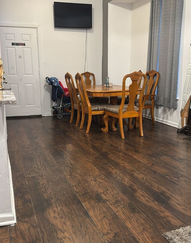 dining area featuring dark hardwood / wood-style flooring