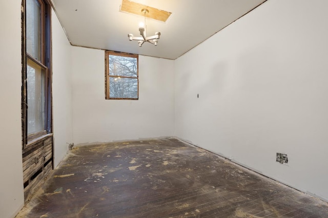 empty room featuring a chandelier