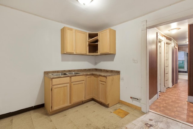 kitchen featuring light brown cabinetry and sink