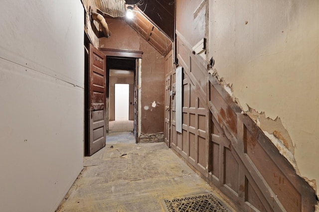 hall featuring vaulted ceiling