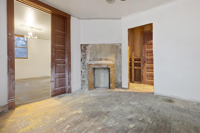 unfurnished living room with a notable chandelier